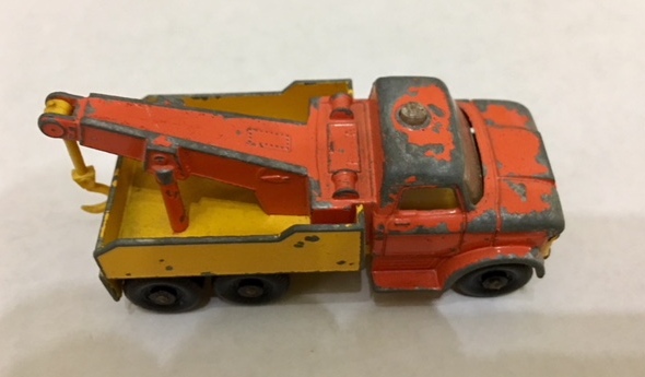 71c Ford heavy duty wreck truck in yellow-orange with amber glazing