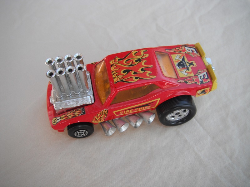 1. PP/Red body/yellow base/amber windows/large chrome exhaust pipes on sides/Fire chief and flames labels.