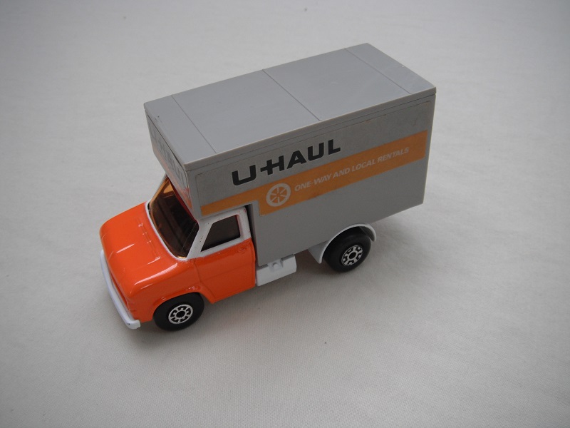 19. Orange &amp; white cab/white base/gry roof/amber windows/5 arch(f)5 crown(r) wheels/red axle cover/U Haul labels.