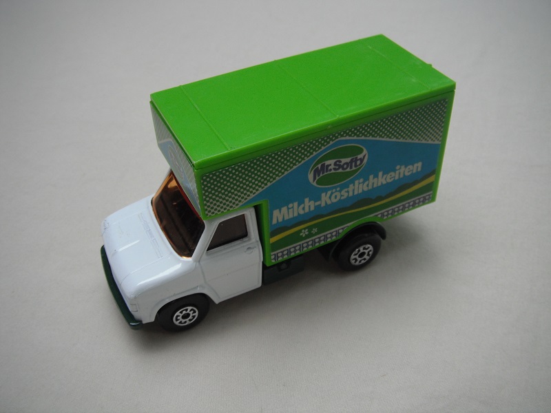 14. White body/dk.grn base/lt.grn roof/lt.amber windows/5 arch(f)5 crown(r) wheels/red axle cover/Mr. Softy labels.