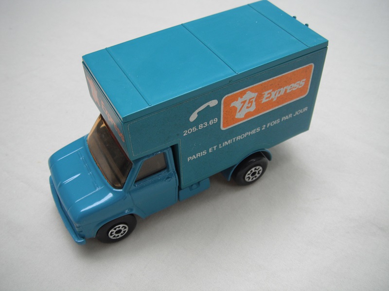 7. Turquoise body, roof &amp; base/lt.amber windows/5 arch(f)5 crown(r) wheels/blk axle cover/75 Express labels.