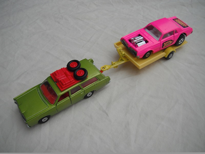 6.  Metallic green Mercury/unpainted K23 England base/dark red interior &amp; roof rack/clear windows/yellow trailer K28-2/type B/ hot pink Cougar.