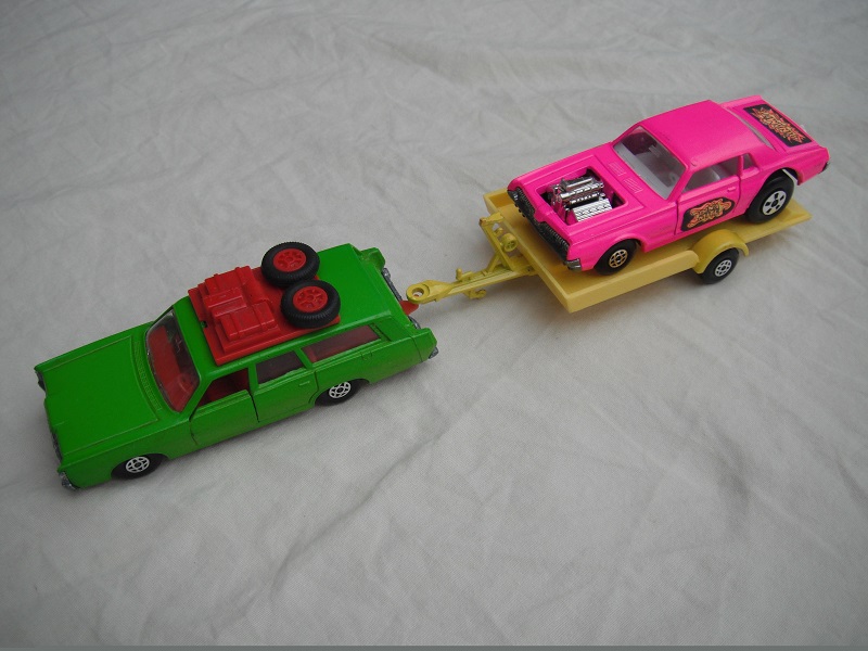 5.  Dark lime green Mercury/unpainted K23 England base/dark red interior &amp; roof rack/clear windows/yellow trailer K28-1/type B/ hot pink Cougar.