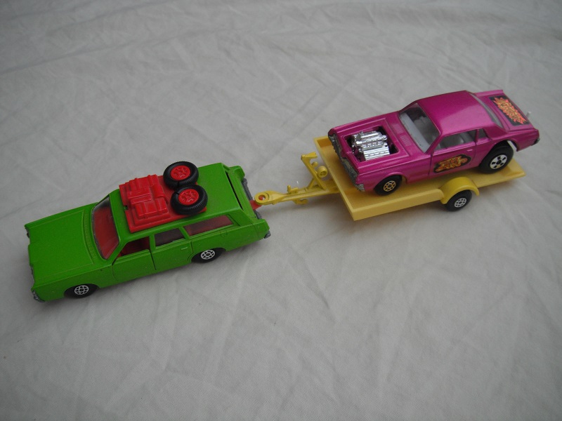 2.  Lime green Mercury/ unpainted K23 England base/red interior &amp; roof rack/clear windows/yellow trailer K28-2/type A/ metallic purple Cougar.