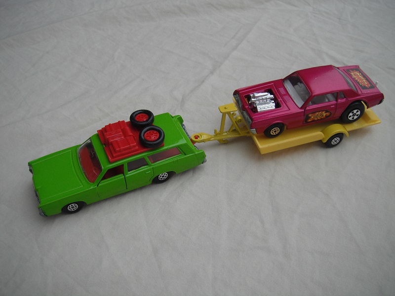 1.  Lime green Mercury/ unpainted K23 England base/dark red interior &amp; roof rack/clear windows/yellow trailer K28-1/type A/ metallic purple Cougar.