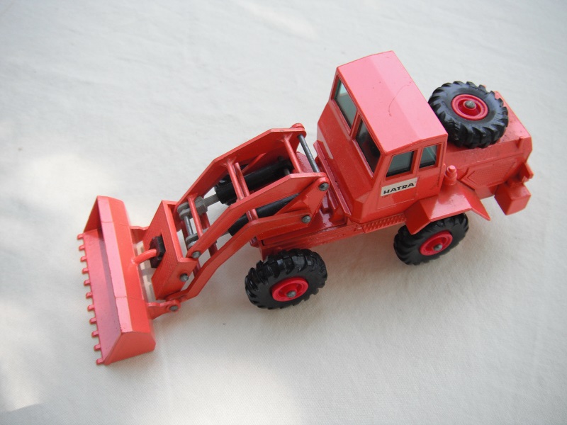 7. DK.orange body/with blk pad/BPT/grn windows/closed TL/painted rivets/&quot;Hatra&quot; thin lettering decal/white background.