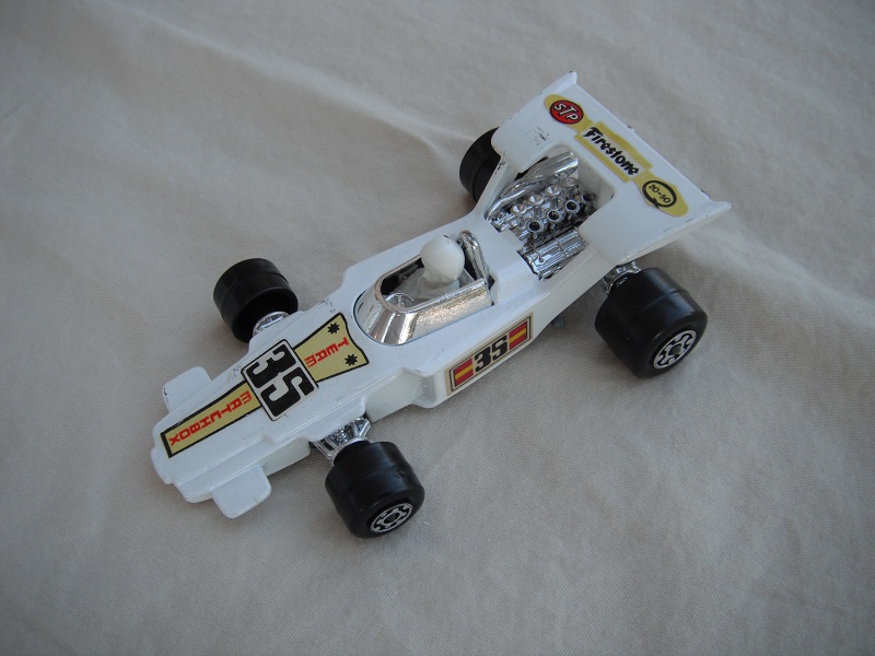 16. White body/unpainted Speedkings base/type A wheels/white driver with white helmet/&quot;35 Team Matchbox &amp; Firestone&quot; labels/rectangular on sides.