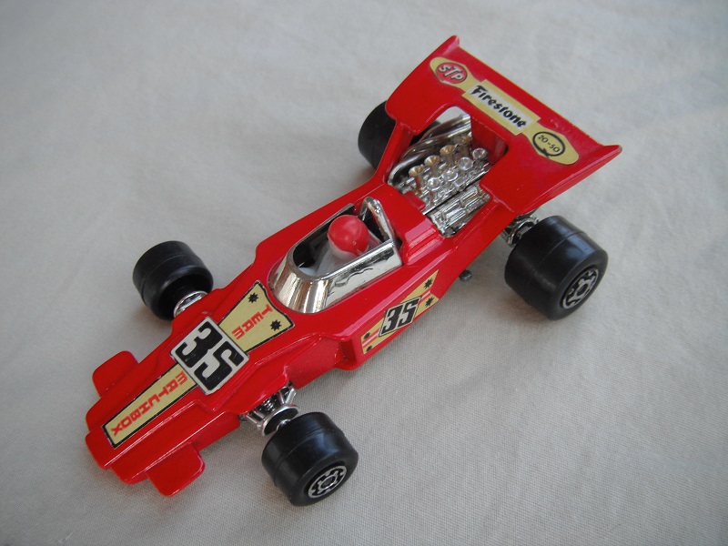 11. Dk.red body/unpainted Speedkings base/type A whls/white driver with dk.red helmet/&quot;35 Team Matchbox &amp; Firestone&quot; labels/irregular side labels.