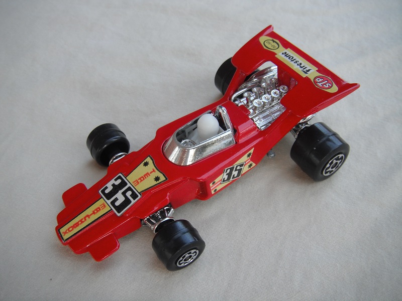 8. Dk.red body/unpainted Speedkings base/type A whls/opaque driver/&quot;35 Team Matchbox &amp; Firestone&quot; labels/upside down rear label/irregular side labels.