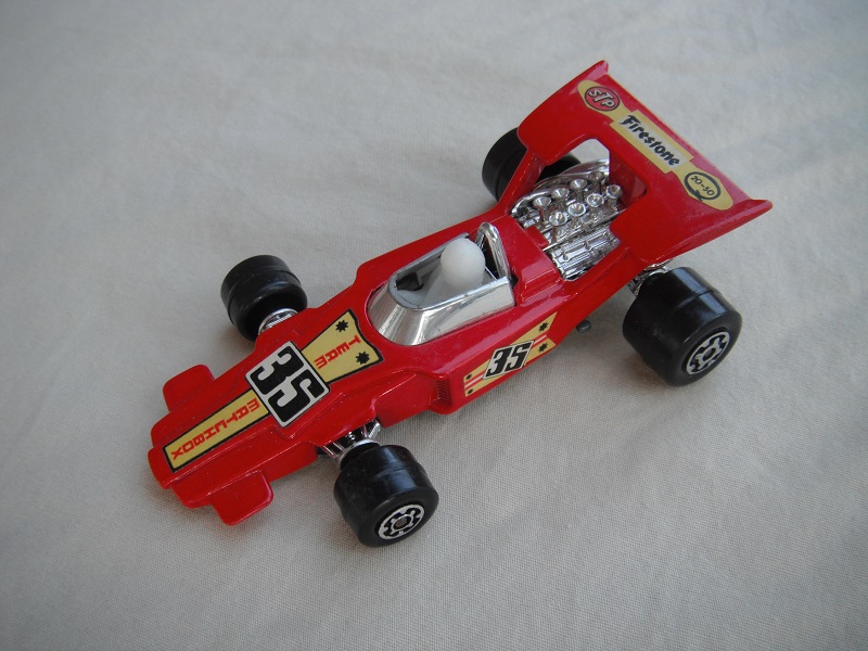 7. Dk.red body/unpainted Speedkings base/type A whls/opaque driver/&quot;35 Team Matchbox &amp; Firestone&quot; labels/irregular side labels.