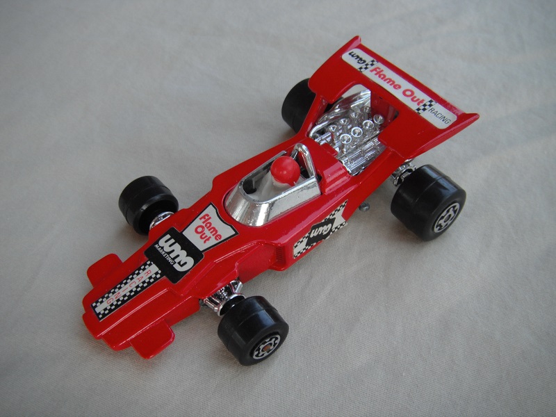 5. Dk.red body/unpainted Speedkings base/type A whls/white driver with red helmet/&quot;Flame out&quot; labels/irregular side labels.