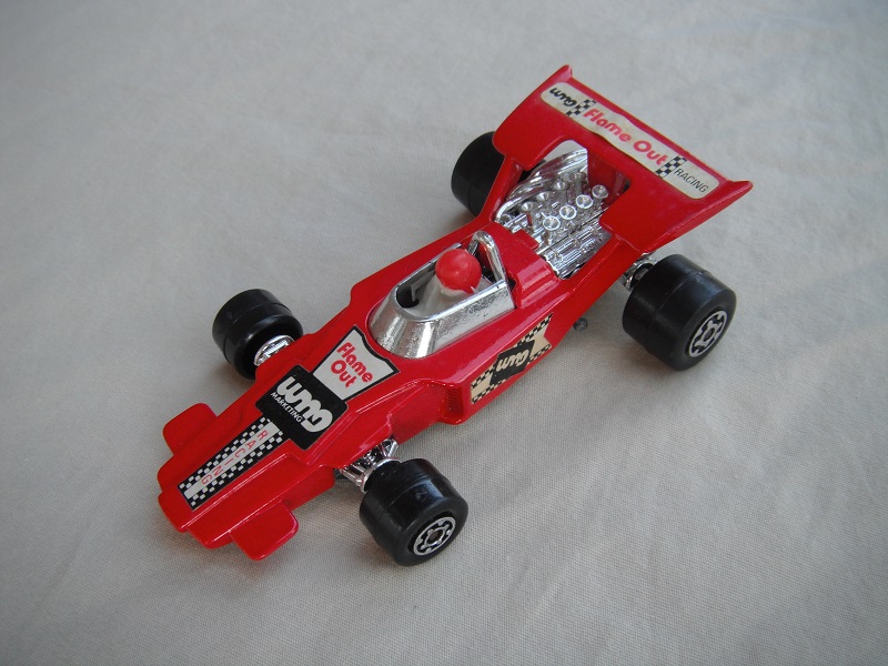 4. Red body/unpainted Speedkings base/type A whls/white driver with red helmet/&quot;Flame out&quot; labels/irregular side labels.