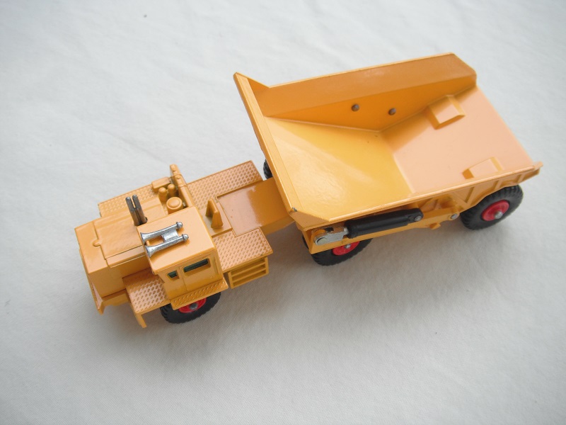 4. Yellow body/type 3 base/with rivet braces/plate on cab's rear axle/green windows/KW-Dart decals.