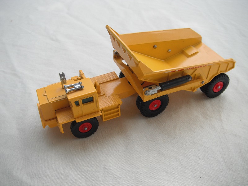 1. Yellow body/type 1 base/no rivet braces/ webs on cab's rear axle/green windows/KW-Dart decals.