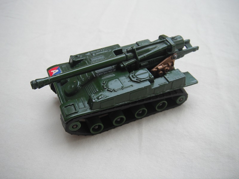 7. Gloss olive green body/matt blk base/dk.green rollers/smooth dk.green cog/dk.gold turret/tan gun elevator.