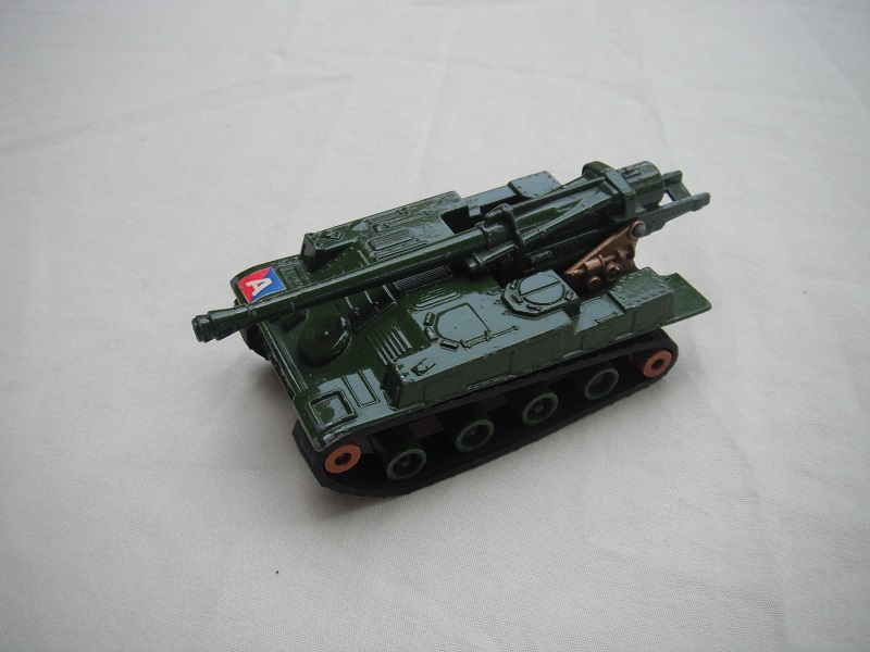 6. Gloss olive green body/matt blk base/dk.green rollers/smooth brown cog/dk.gold turret/tan gun elevator.