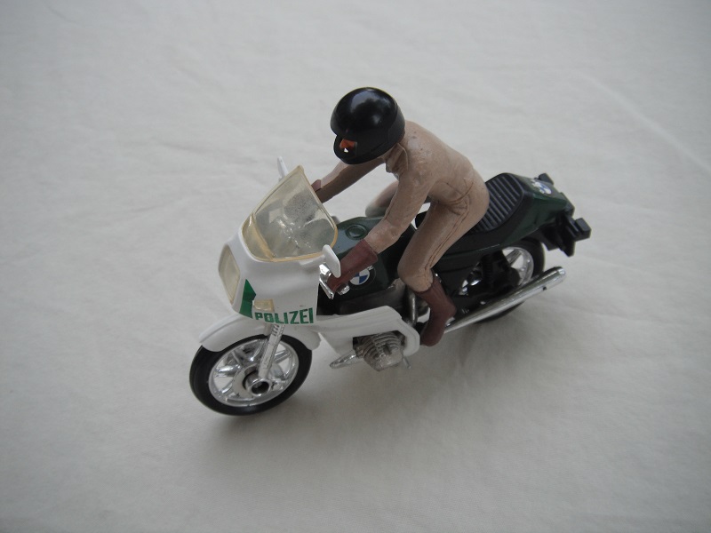 13. Green &amp; white MC/tempered windshield/no saddle bags/driver in tan/brown boots &amp; gloves/black helmet/no visor/Polizei.