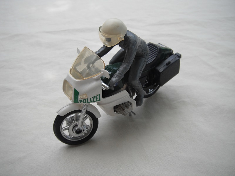 3. PP/Green &amp; white MC/lt.amber windshield/blk saddle bags/driver in gray/gray boots &amp; gloves/wht helmet &amp; tempered visor/BMW.