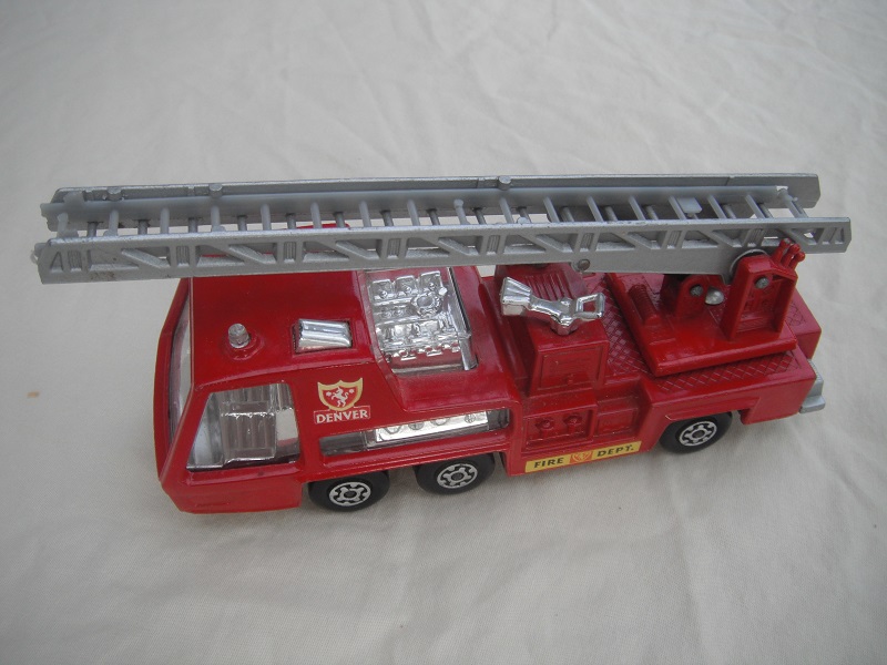 8.  Red body/silver base/red ladder platform/clear windows/opaque ladder insert/Denver &amp; Fire Dept labels.