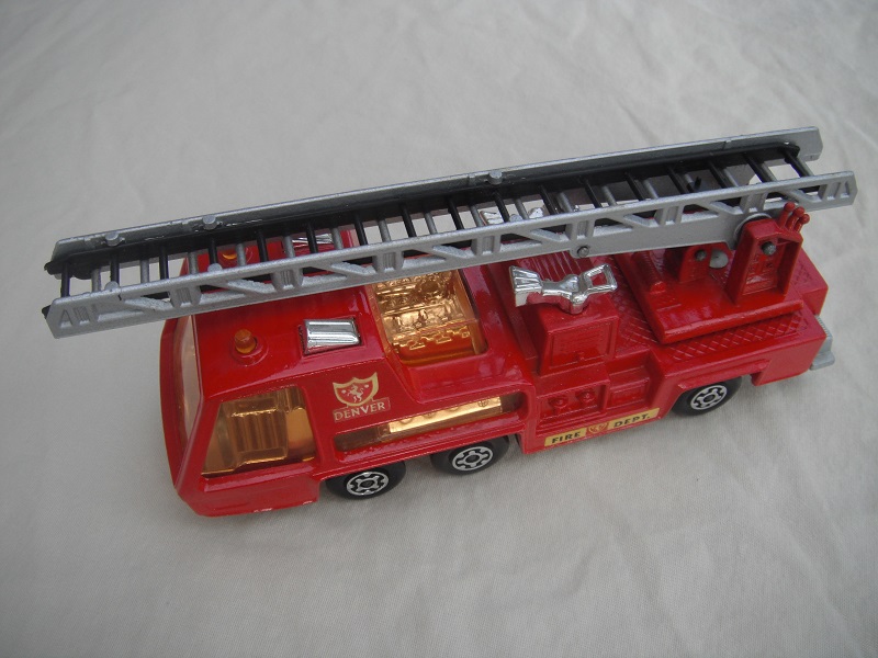 3.  Red body/silver base/red ladder platform/amber windows/black ladder insert/Denver &amp; Fire Dept labels.