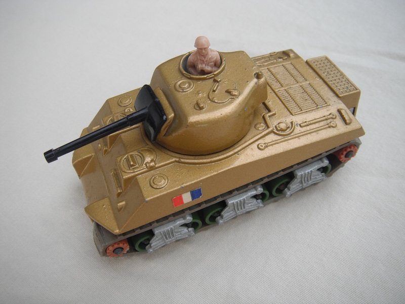 6. Gold body/silver base/green rollers/brown cog with gears/gray tracks/French flag label/beige driver.