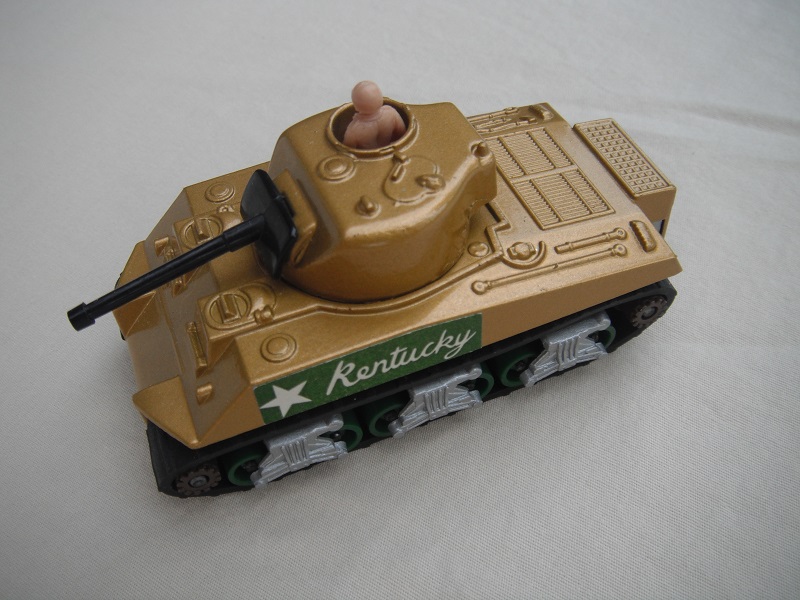 4. Gold body/silver base/green rollers/dk.brown cog with gears/black tracks/dark green Kentucky label/beige driver.