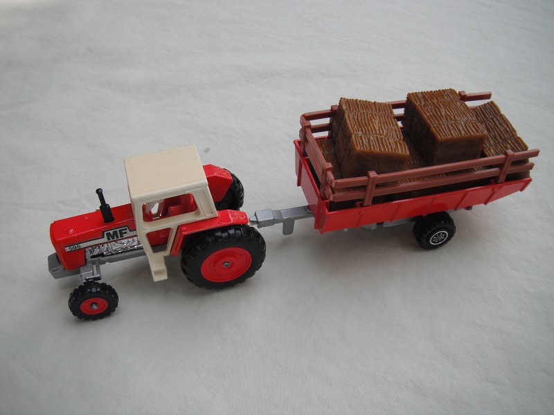 1. Lt.red body/crm canopy/sil base England/opn//BPT/lt.red hubs/wht steering/lt.red tlr/lt.brn stakes/sil base #1/8 dot chrm whls/wht tow eye/MF 595 lbls/logo on rad.