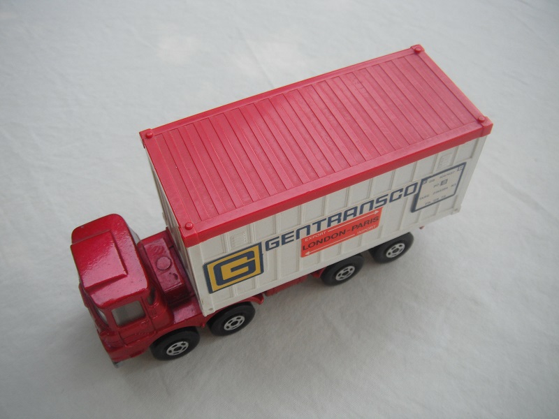 3. Met.red cab/sil base type a/blk open axle cover/wht container w/red roof/Gentransco labels in blue.