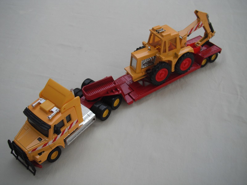 2. Yel cab/dk.red base/yel 8 dot whls/clr wind/blk int/darker red trailer/digger in dk.yellow/China base/dk.red scoop/amb wind/red&amp;wht stripes.