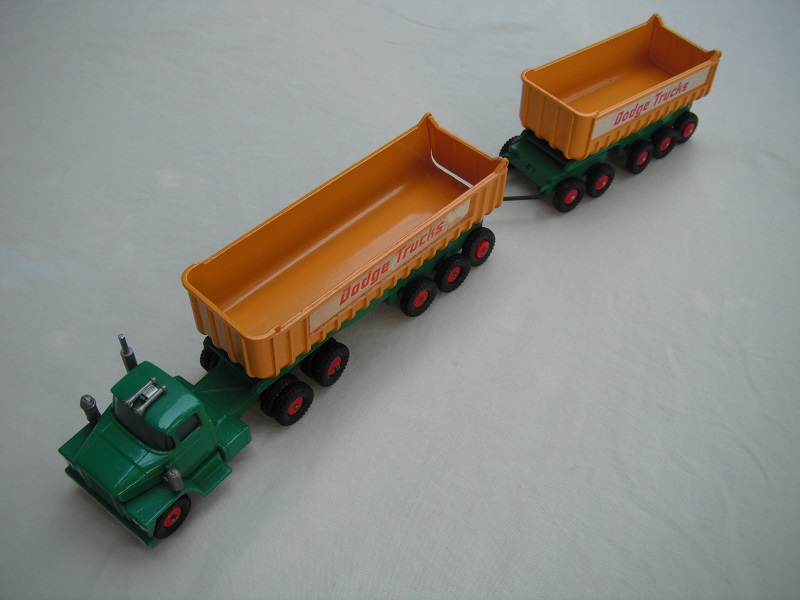 6.Green cab/type 3 base/clr axle holder/dk.yel tipper/type 3 underside/type b tailgate area/&quot;Dodge Trucks&quot; in thick red letters.