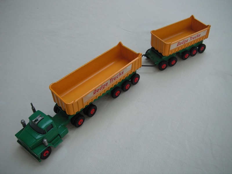 5.Green cab/type 3 base/blu tint axle holder/dk.yel tipper/type 2 underside/type b tailgate area/&quot;Dodge Trucks&quot; in red letters.