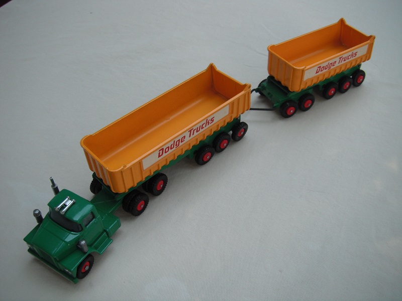 1.Green cab/type 1 base/clr axle holder/dk.yel tipper/type 1 underside/type a tailgate area/&quot;Dodge Trucks&quot; in dk.red letters.