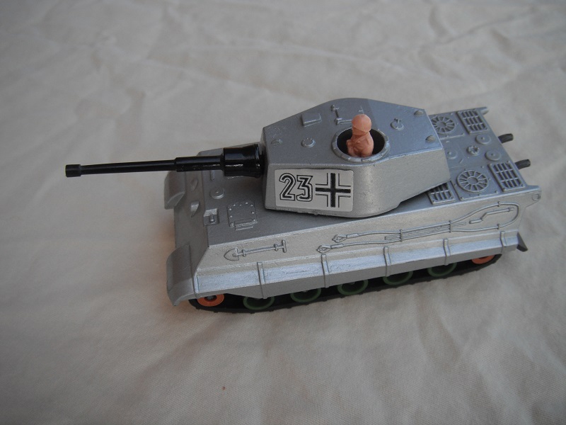 3. Silver body/metallic dk.gray base/green rollers/smooth brown cog/blk tracks/#23 &amp; cross labels/lt.pink driver.