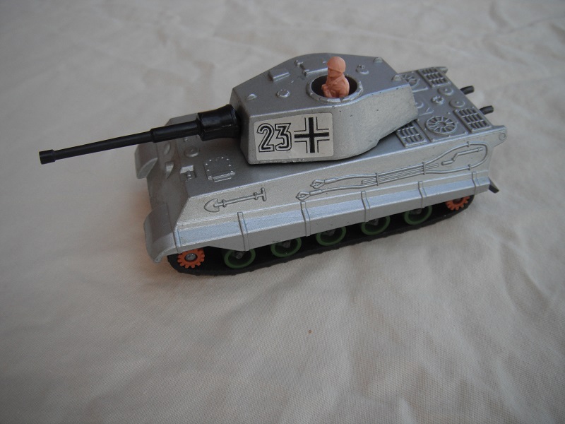 2. Silver body/metallic dk.gray base/green rollers/brown cog w/gears/blk tracks/#23 &amp; cross labels/lt.pink driver.