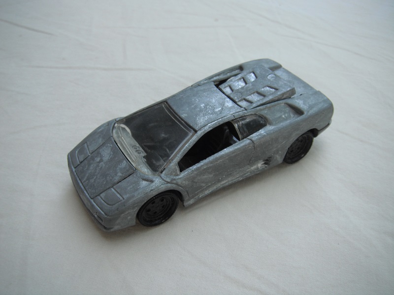 1. Unpainted body/black blank base/5 hole dish wheels/clear windows/black interior/PP.