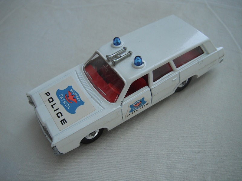 2. Off white body/silver base/ BRT with chrome hubs/clear windows/red interior/blue Police labels on hood &amp; sides.