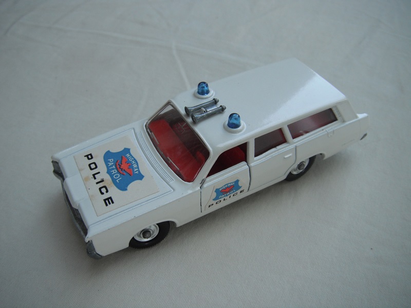 1. White body/silver base/ BRT with chrome hubs/clear windows/red interior/blue Police labels on hood &amp; sides.