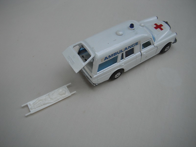 K63A Mercedes Benz Ambulance with patient on stretcher.jpg