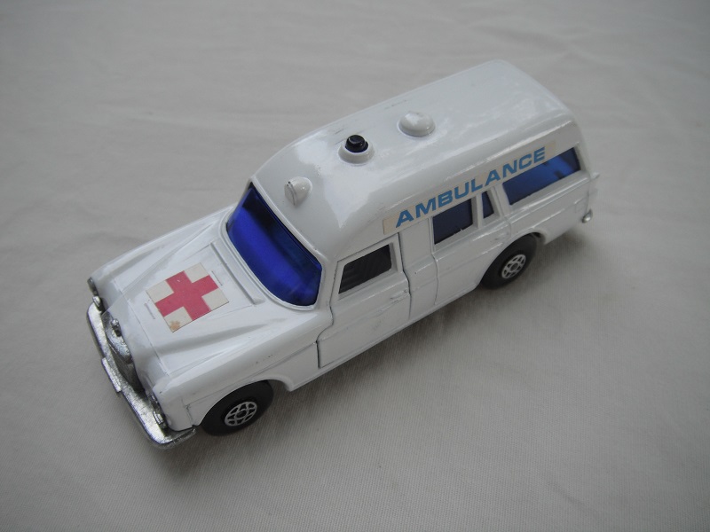 4. Off white body/black speedkings base/spiro wheels/very dk.blue windows/white interior/&quot;Ambulance&quot; on sides/straight red cross label.