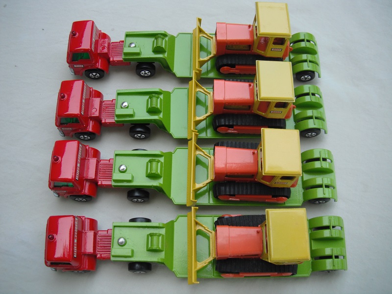 K17A Low loader with bulldozer red cabs painted pivot group picture.jpg