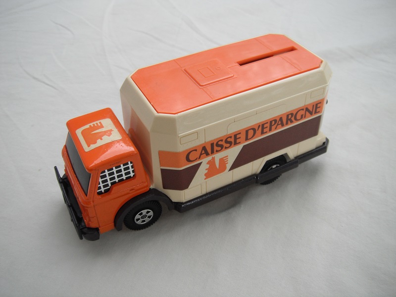 3. Orange cab/cream container/org roof/dk.brn base/Lesney England/5 spk whls/org axle covers/blk windows w/mesh/Caisse D'Epargne.