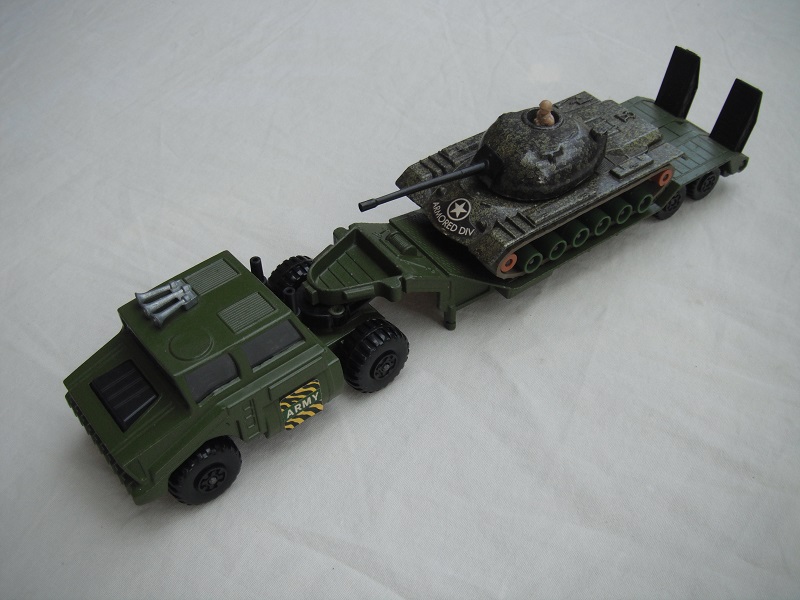 8. Olive grn cab/type 2/matt blk base/blk int/clr windows/blk MC whls/blk 5th whl/no lock pin/blk stacks/type 1 trailer/grn camo tank w/grn &amp; tan rollers.