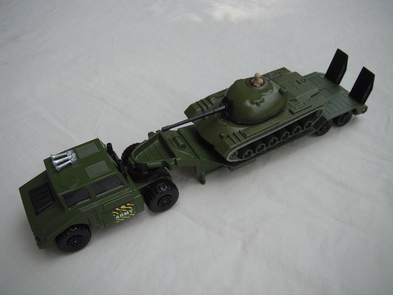 7. Olive grn cab/type 2/matt blk base/blk int/clr windows/blk MC whls/blk 5th whl/with lock pin/blk stacks/type 1 trailer/olive grn tank w/grn rollers.