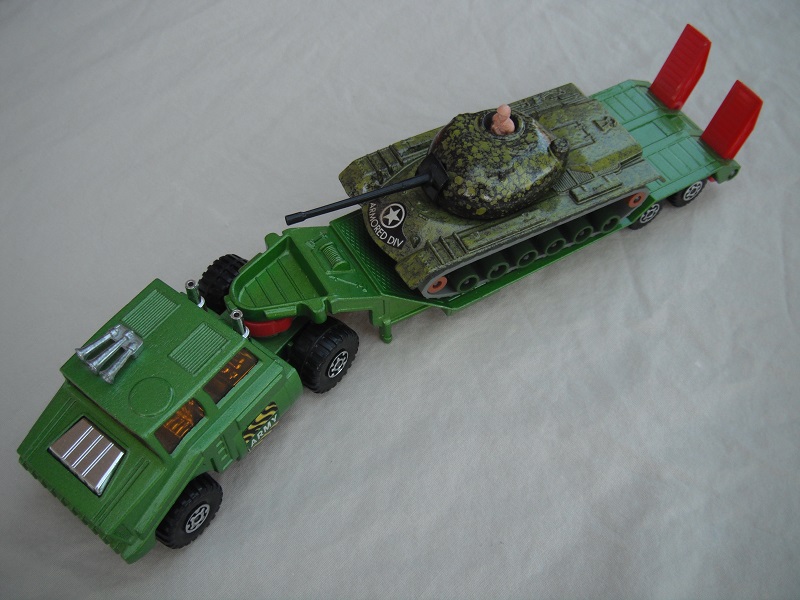 1. Met. grn cab/type 1/matt blk base/chrm int/amb wind/chrm MC whls/red 5th whl/no lock pin/chrm stacks/type 1 trailer/grn camo tank w/grn&amp;tan rollers.