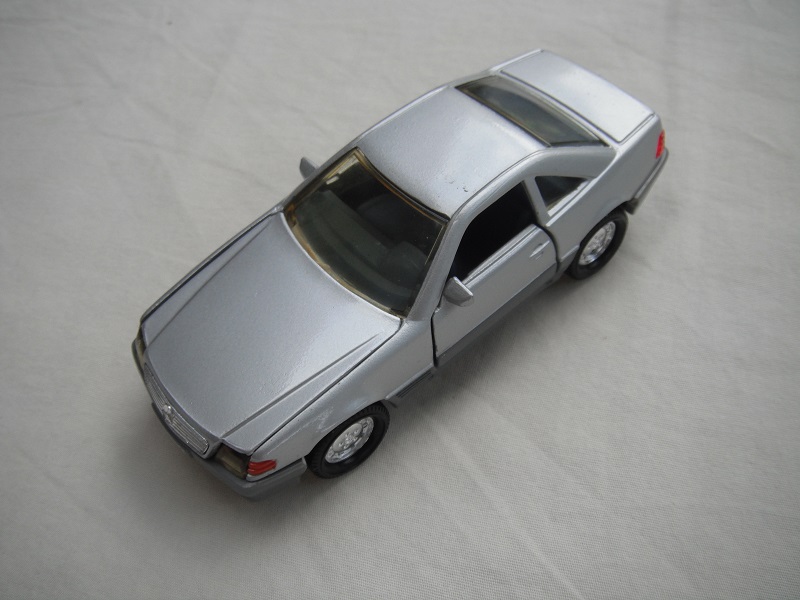 6. Silver body/gray base/chrome dish wheels/amber windows/dk.gray interior/amber headlights/dk.orange sidelights.