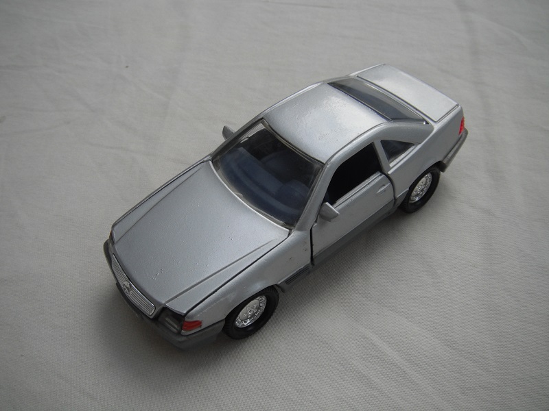 4. Silver body/gray base/chrome dish wheels/clear windows/dk.gray interior/clear headlights/dk.orange sidelights.