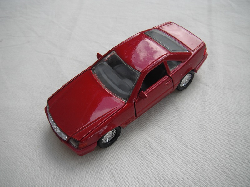 3. Metallic red body/maroon base/chrome dish wheels/clear windows/dk.gray interior/clear headlights/orange sidelights.