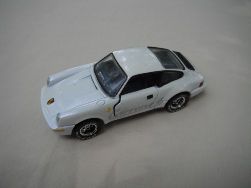 5. Pearly white body/detailed blk China base/5 hole deep dish whls/clr windows/very dk.blue interior/dk yel side lts/Carrera 4.