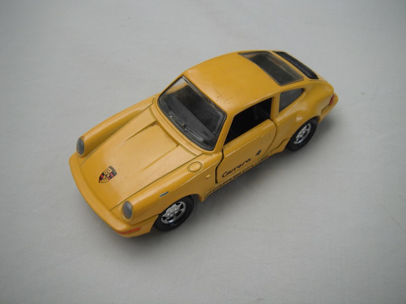 3. Yellow body/black China base/7 spoke deep wheels/clear windows/black interior/Carrera 4 Porsche.