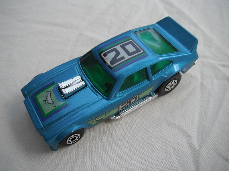 4. Met. blue body/blk Speedkings base/dk.green windows/white int/chrome side pipes/&quot;20&quot; &amp; Mustang labels.